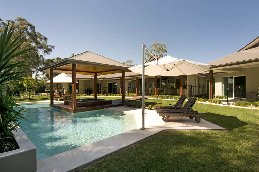 Example of a trendy custom-shaped pool design in Sunshine Coast