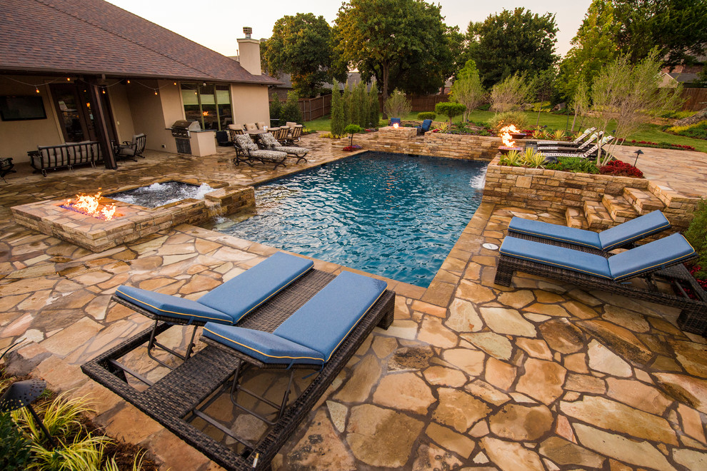 Inspiration for a mid-sized modern backyard stone and rectangular lap pool fountain remodel in Oklahoma City