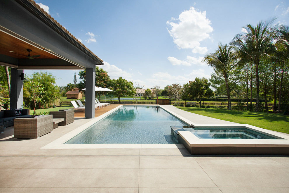 Inspiration for a contemporary back rectangular swimming pool in Miami.