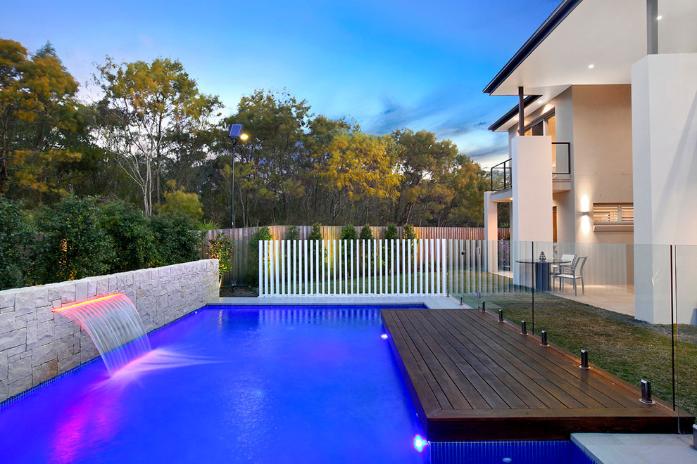 Photo of a contemporary swimming pool in Sydney with decking.