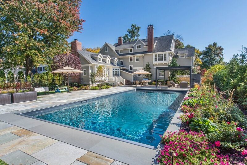 Inspiration for a large transitional backyard stone and rectangular lap pool remodel in New York