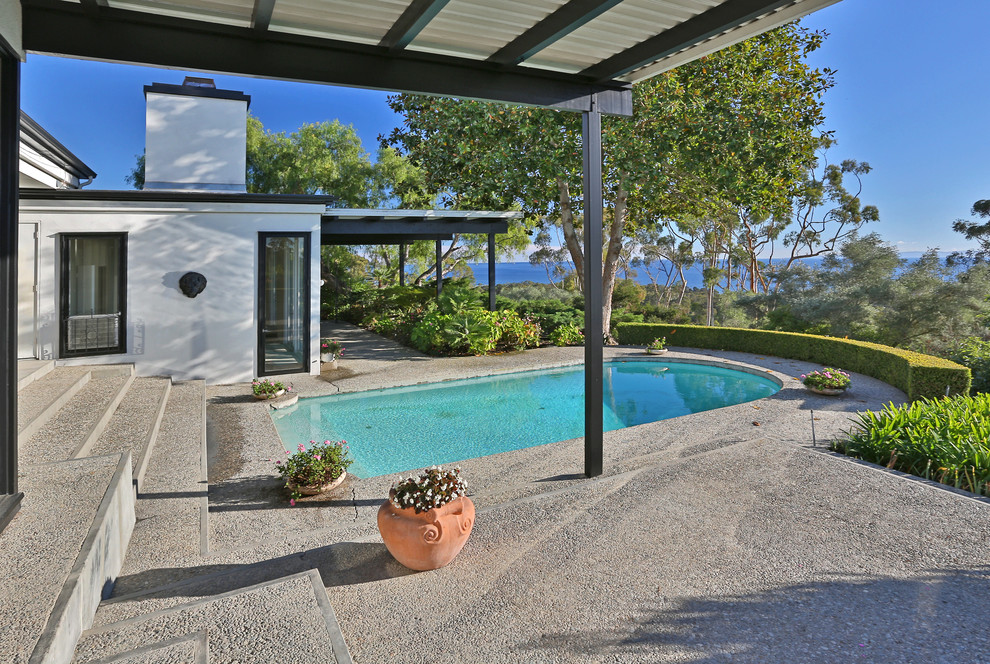 Inspiration for a transitional concrete and custom-shaped pool remodel in Santa Barbara