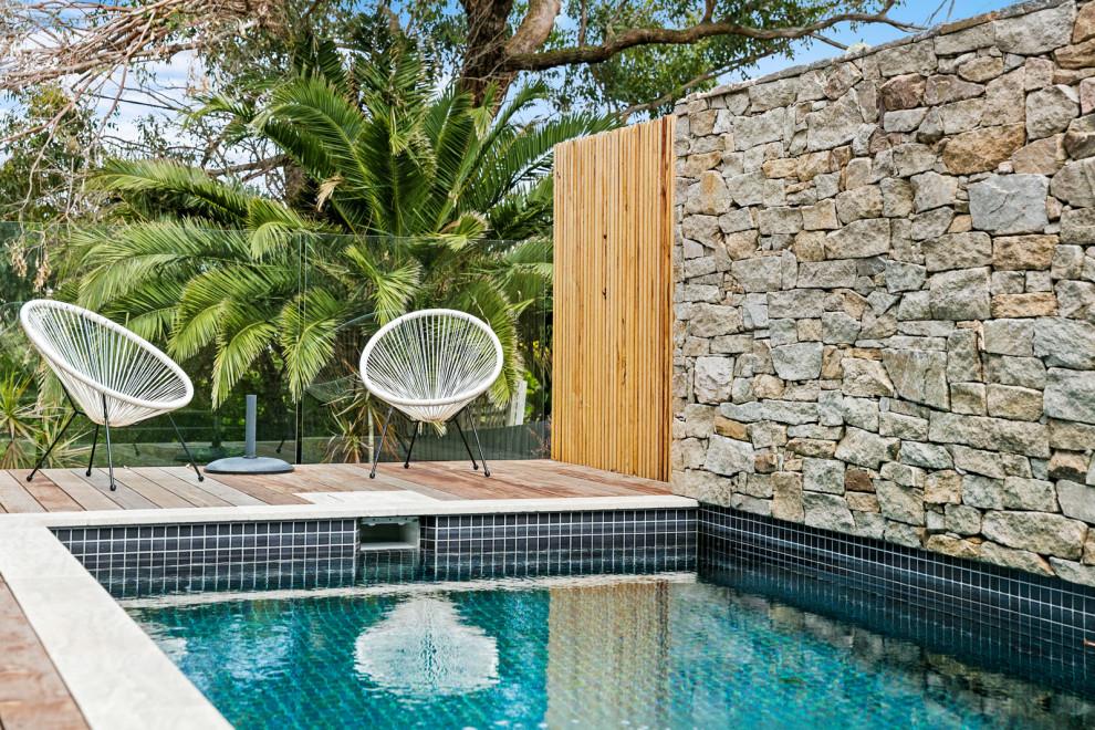 Medium sized contemporary swimming pool in Brisbane with decking.