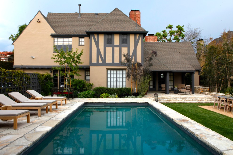 This is an example of a classic rectangular swimming pool in Los Angeles with fencing.