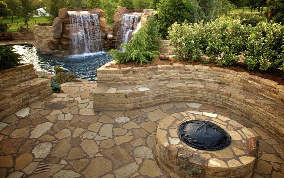 Multiple Waterfalls and Diving Ledges Highlight This Swimming Pool