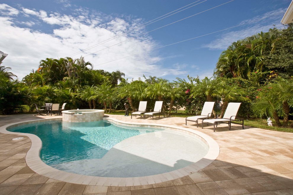 This is an example of a world-inspired custom shaped swimming pool in Miami.