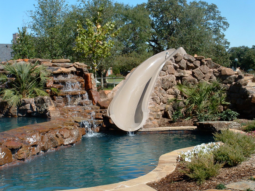 Natural Beach Entry Freeform Pool with slide, table and cascading ...