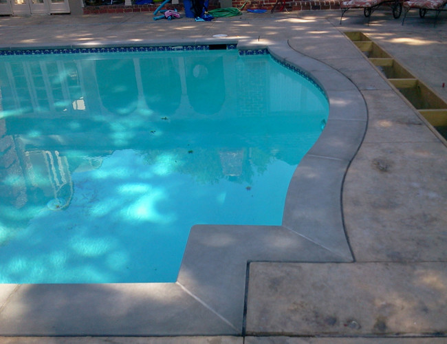 Natural Stone Pool coping, fire pit, and outdoor barbeque Modern Pool Kansas City by