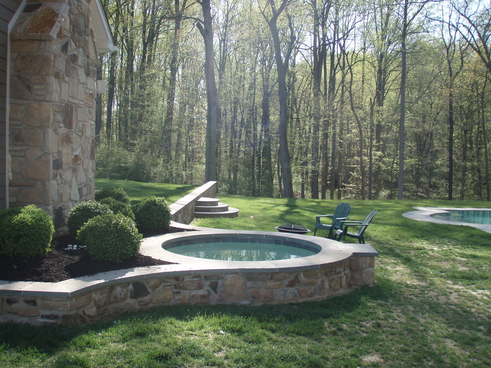 Example of a classic backyard stone pool design in Baltimore