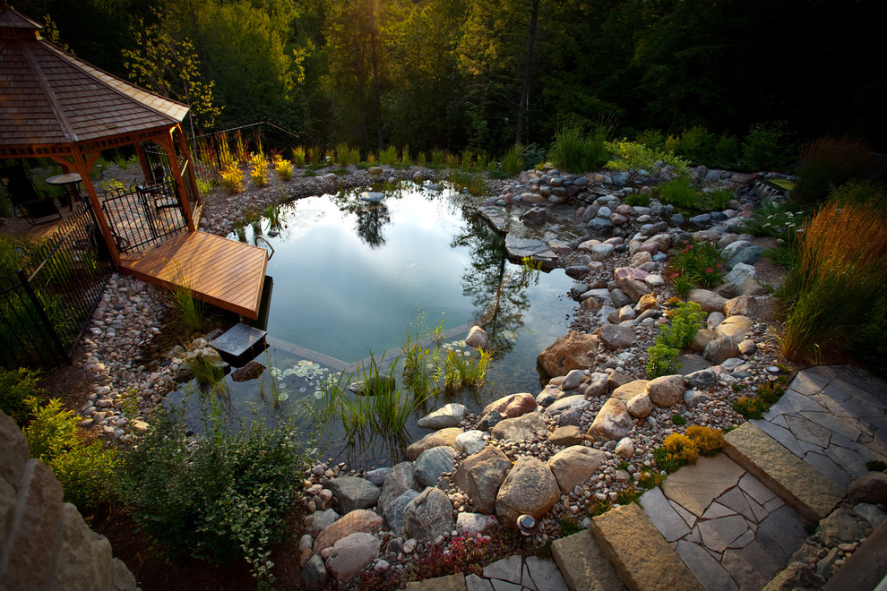 Pool - small traditional backyard stone and custom-shaped natural pool idea in Toronto