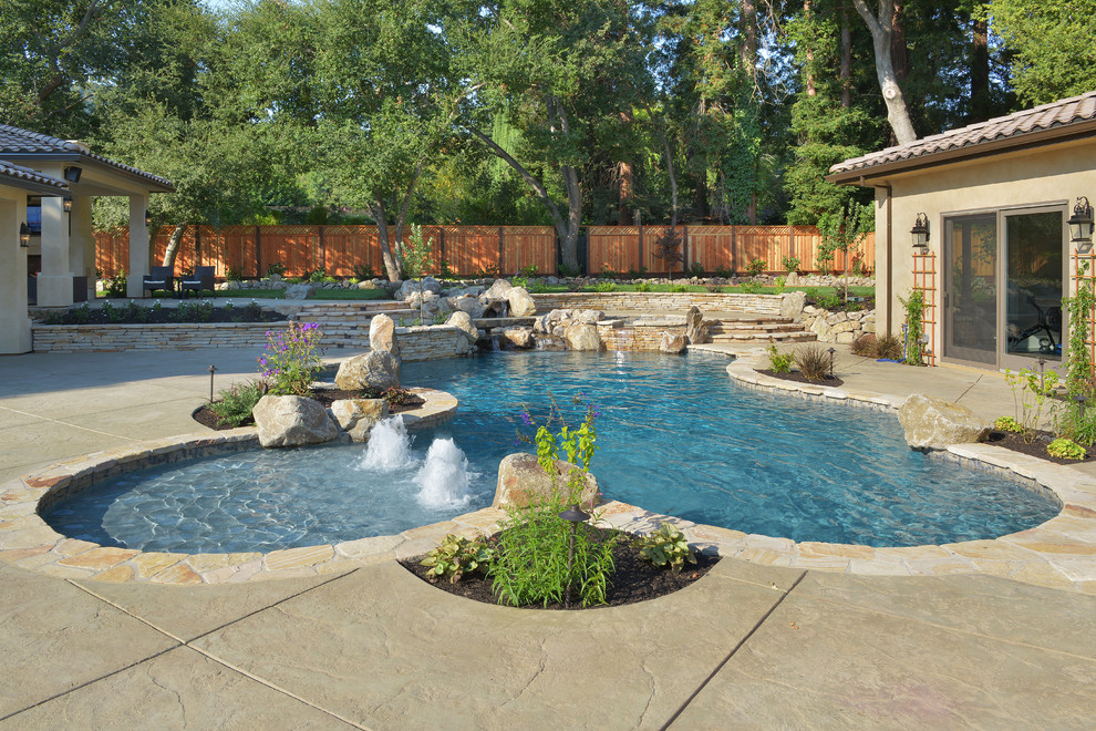 Inspiration for a huge mediterranean backyard stone and custom-shaped lap pool fountain remodel in San Francisco
