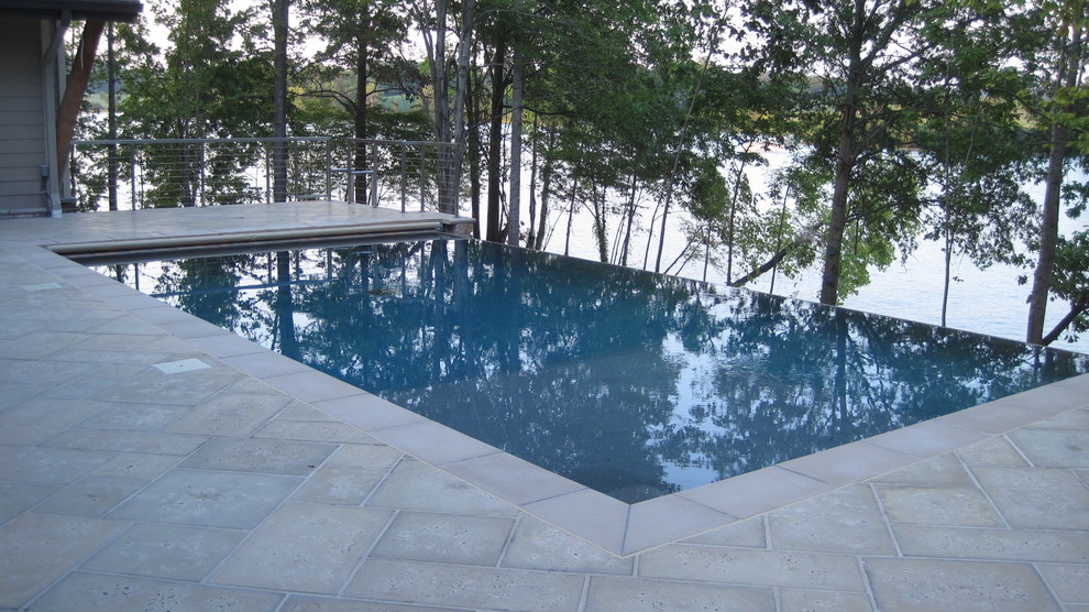 Hot tub - mid-sized traditional backyard concrete paver and rectangular infinity hot tub idea in DC Metro