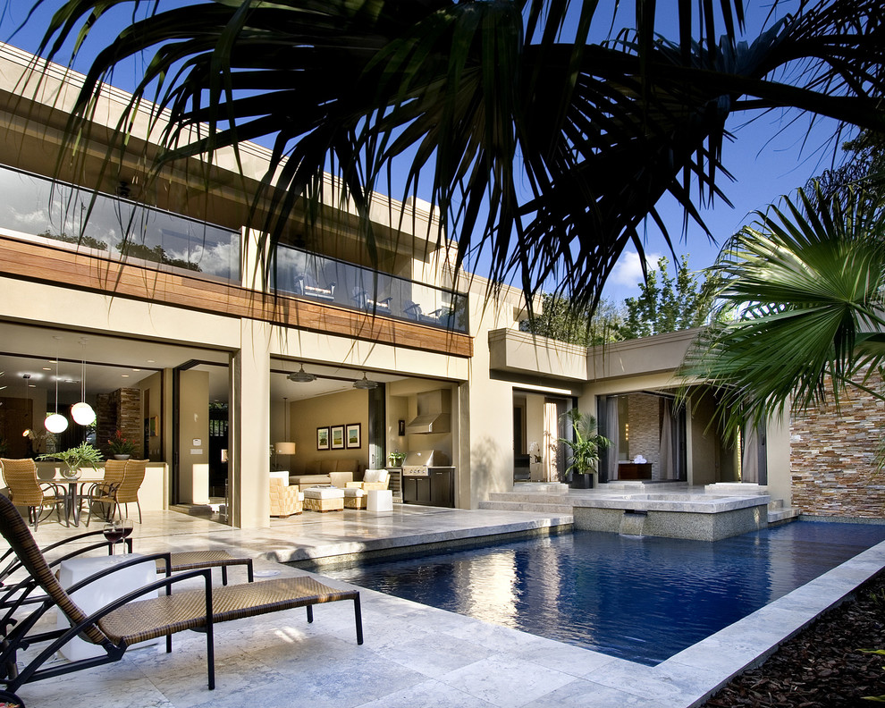 Trendy courtyard l-shaped pool photo in Orlando