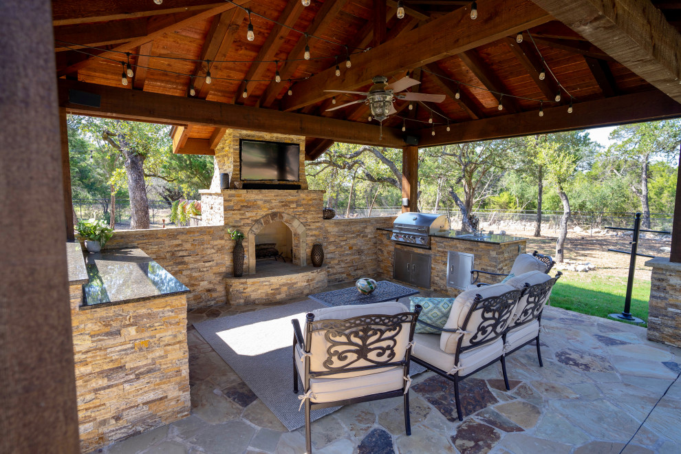 This is an example of a large classic back patio in Austin with decking.