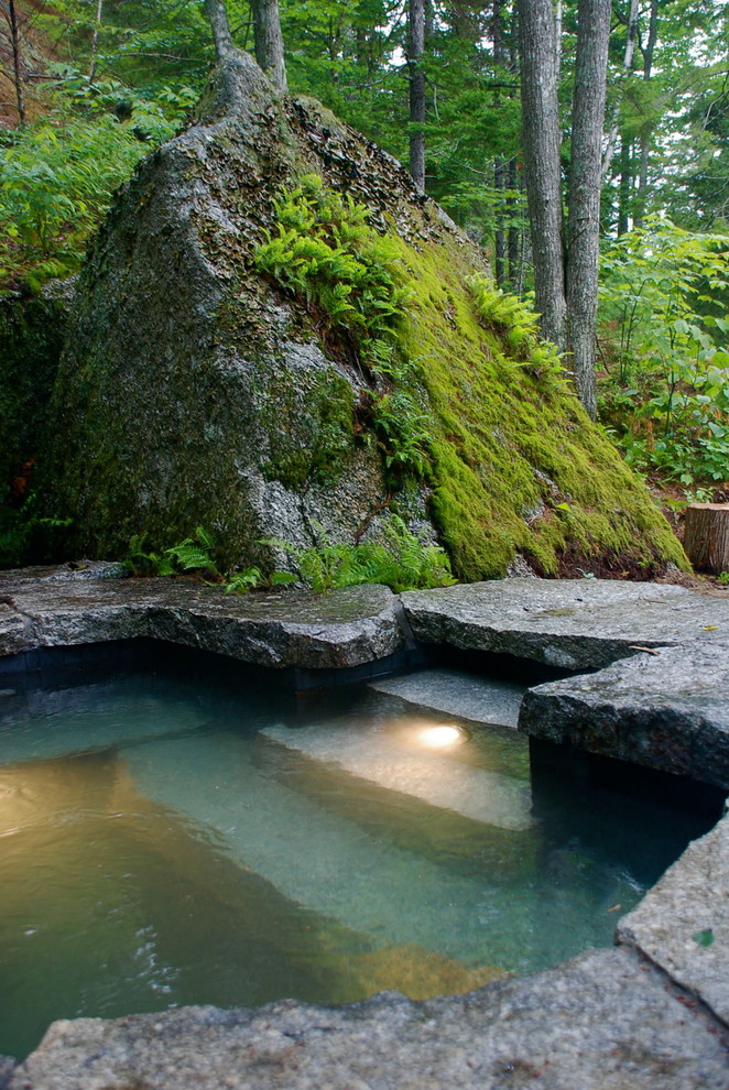 Design ideas for a medium sized rustic back custom shaped natural hot tub in Portland Maine with natural stone paving.