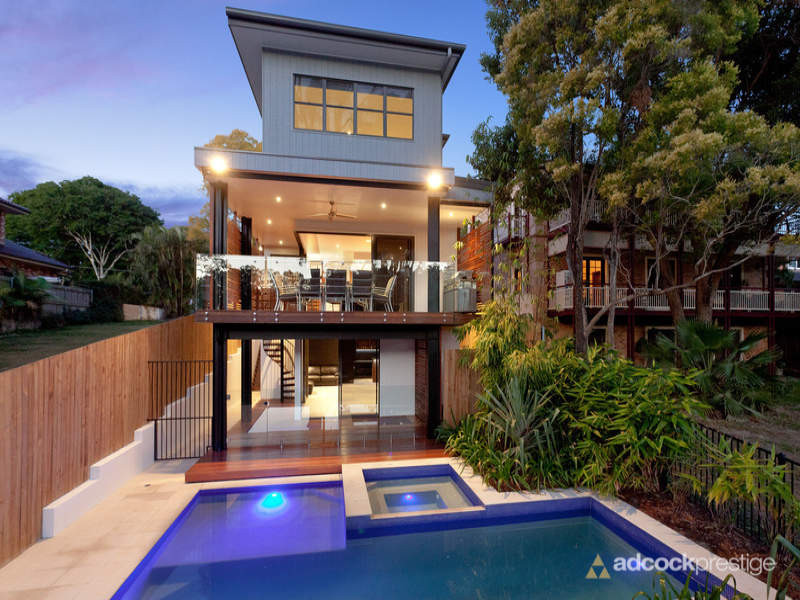 Mid-sized trendy backyard stone and custom-shaped lap hot tub photo in Brisbane
