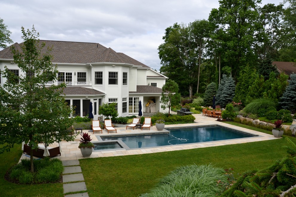 Inspiration for a large contemporary backyard concrete paver and rectangular lap pool house remodel in New York