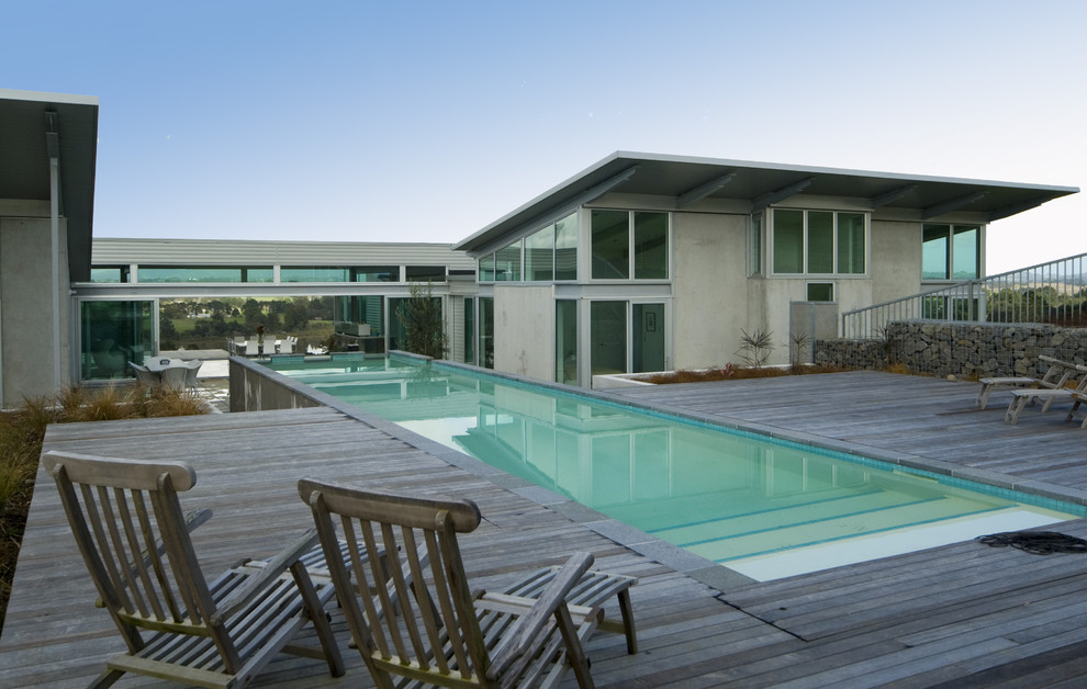 Contemporary lengths swimming pool in Auckland with decking.