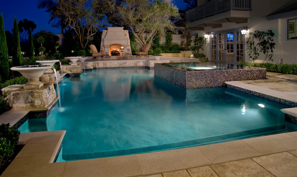 Hot tub - large contemporary backyard stone and rectangular lap hot tub idea in Orange County