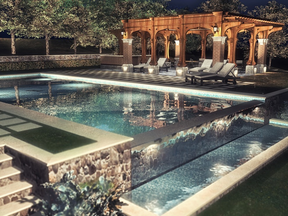 Photo of a large classic rectangular infinity swimming pool in New York with a water feature.