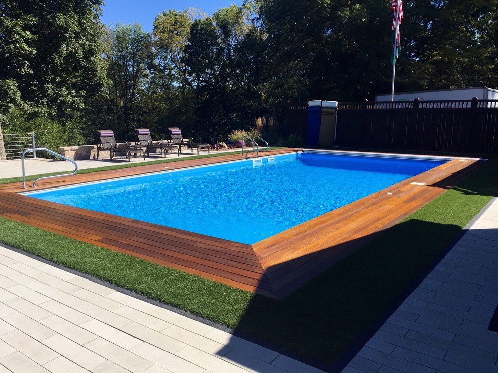 Photo of a large contemporary back rectangular swimming pool in Indianapolis with decking.