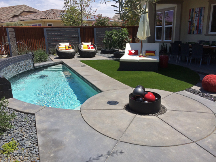 Inspiration for a small contemporary backyard concrete and custom-shaped pool remodel in Phoenix