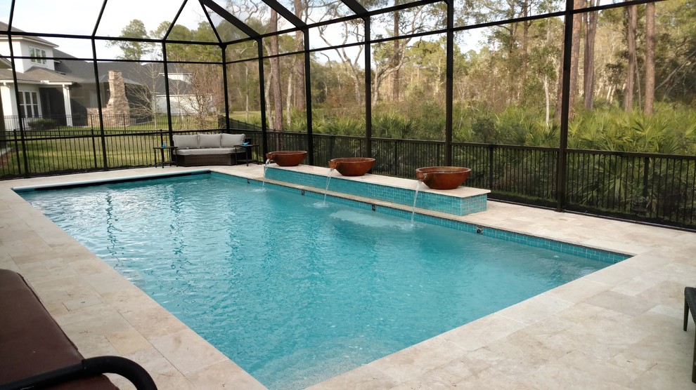Inspiration for a mid-sized transitional backyard stone and rectangular lap pool fountain remodel in Jacksonville