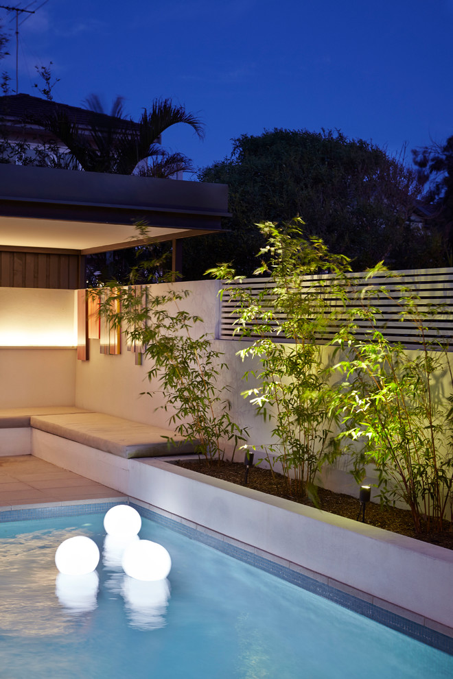 Pool - mid-sized mid-century modern pool idea in Sydney