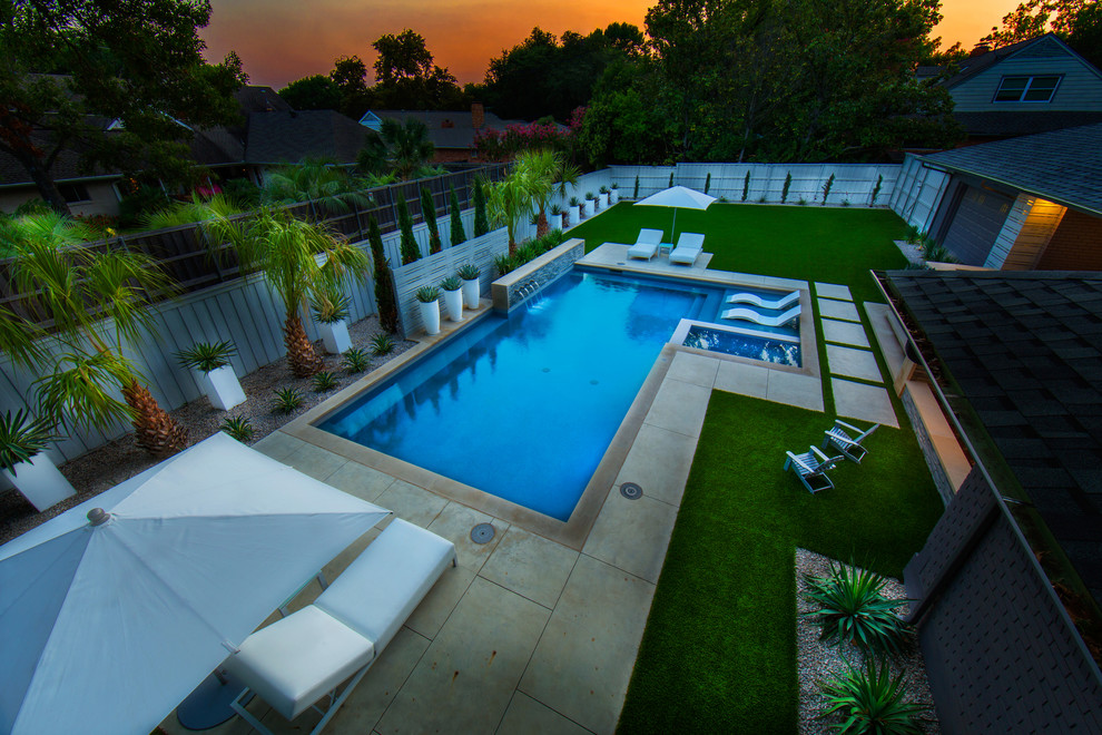 Mid-sized minimalist backyard rectangular hot tub photo in Dallas