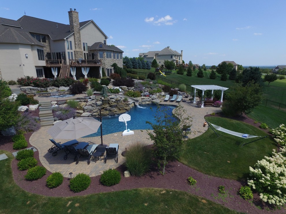 North Whitehall custom pool with boulder waterfall, slide, & separate