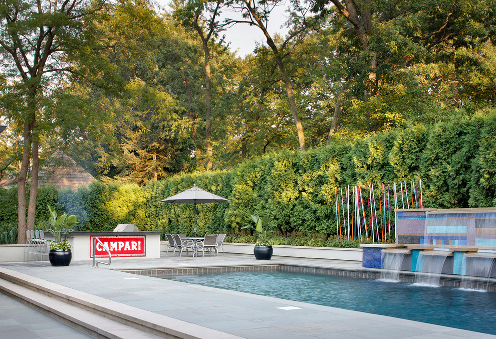 Photo of a contemporary rectangular swimming pool in Chicago with a bbq area.