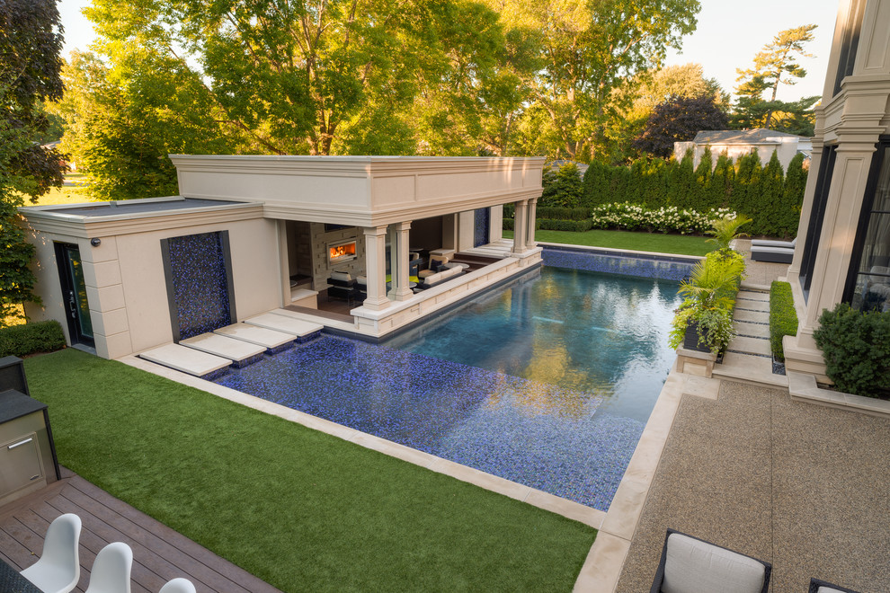 Huge minimalist backyard custom-shaped pool house photo in Toronto