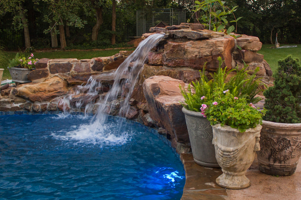 Pool fountain - mid-sized backyard custom-shaped pool fountain idea in Oklahoma City