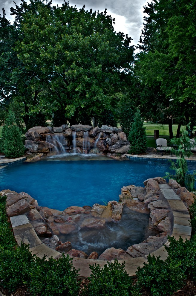 Inspiration for a mid-sized transitional custom-shaped natural pool remodel in Oklahoma City