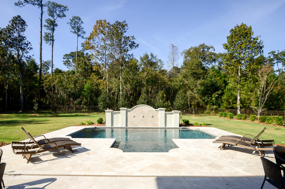 Pool - mid-sized traditional backyard tile and custom-shaped pool idea in New Orleans