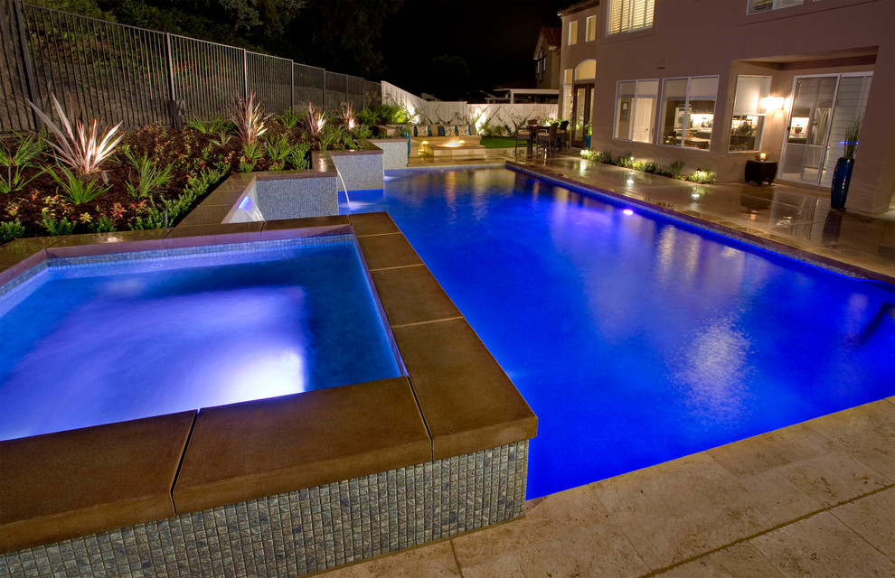 Large trendy courtyard stone and rectangular lap hot tub photo in Orange County