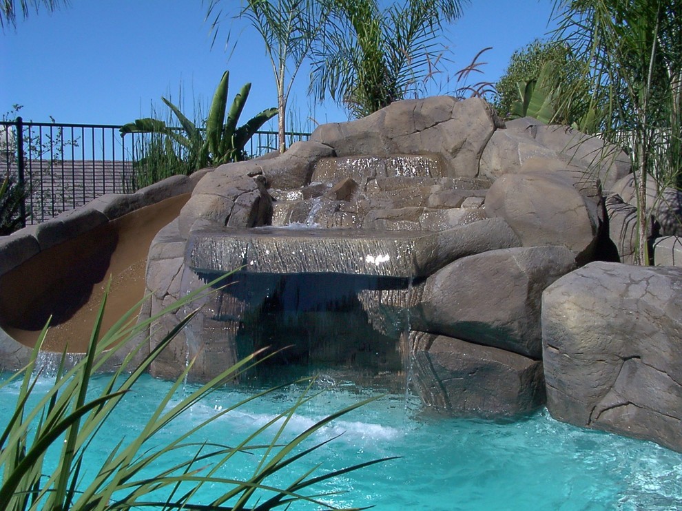 Pool fountain - backyard pool fountain idea in Orange County