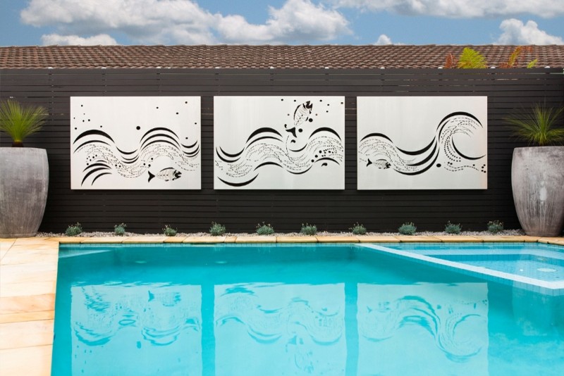 Outdoor living By the pool with Entanglements laser cut metal art Tropical Pool Melbourne