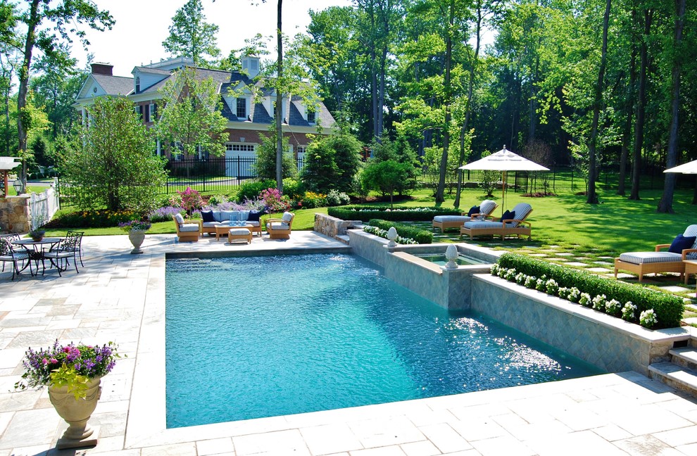 Inspiration for a medium sized classic back rectangular lengths hot tub in New York with natural stone paving.