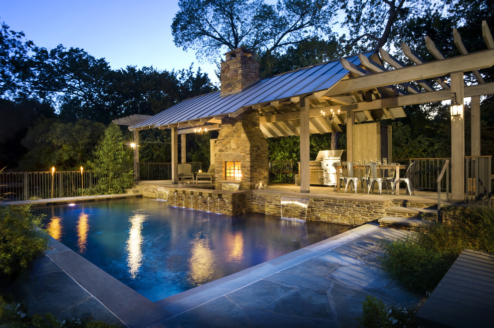 Inspiration for a rustic rectangular swimming pool in Dallas with a pool house.