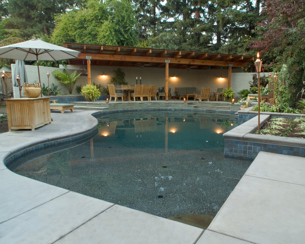 Island style pool photo in Sacramento