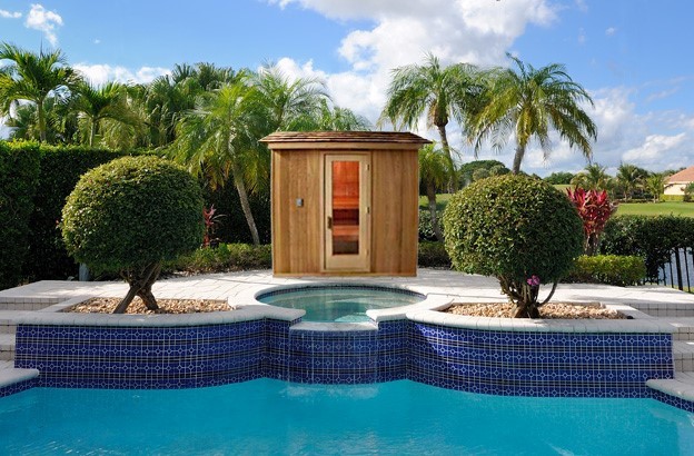 Exemple d'un Abris de piscine et pool houses arrière exotique de taille moyenne et sur mesure avec des pavés en béton.