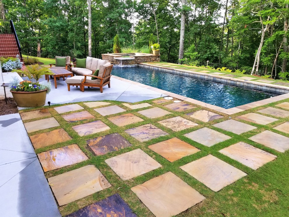 Inspiration for a medium sized traditional back rectangular lengths hot tub in Atlanta with natural stone paving.