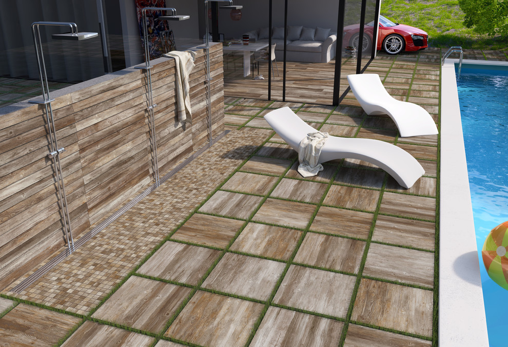 Idee per un'ampia piscina monocorsia minimal rettangolare in cortile con una dépendance a bordo piscina e piastrelle