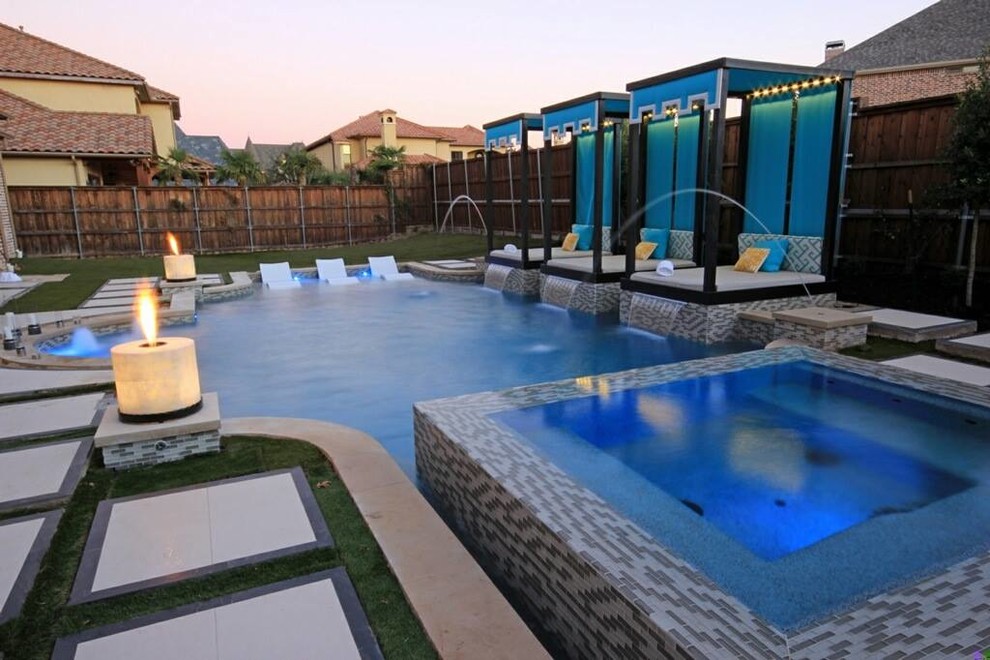 Immagine di una piscina naturale design personalizzata di medie dimensioni e dietro casa con lastre di cemento