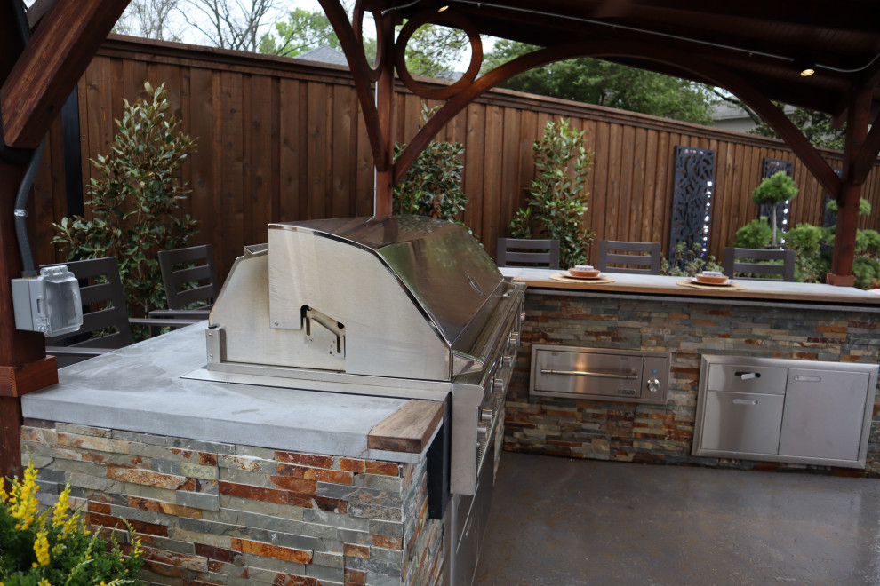 Inspiration for a huge contemporary backyard concrete and custom-shaped lap hot tub remodel in Dallas