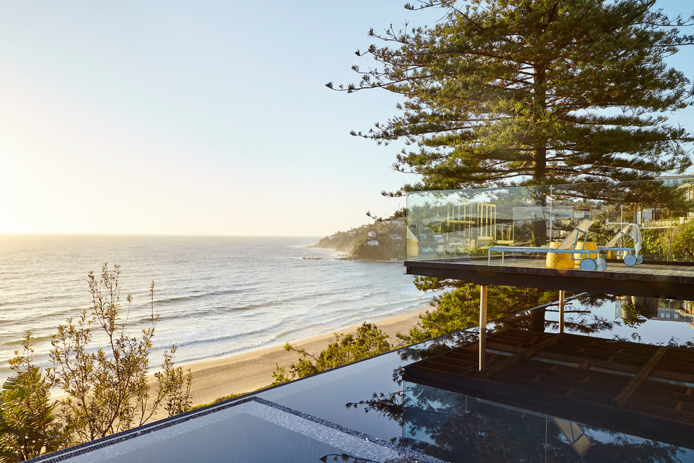 Design ideas for a large beach style rectangular lengths hot tub in Sydney.