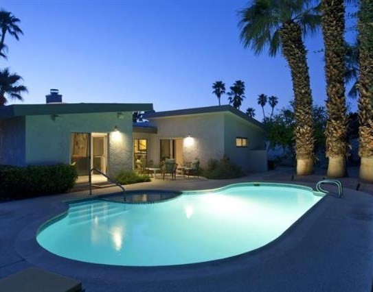 Example of a mid-century modern pool design in Other