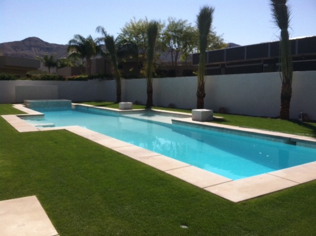 Huge minimalist concrete and rectangular lap pool photo in Los Angeles
