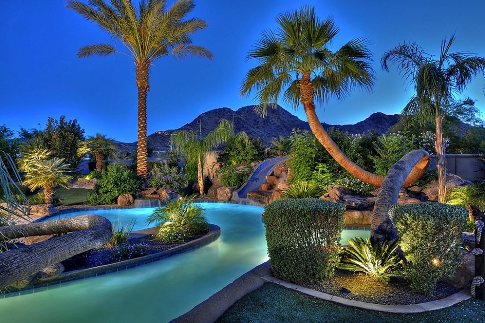 Huge elegant backyard custom-shaped pool photo in Phoenix